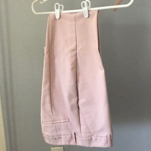 Express columnist in light pink